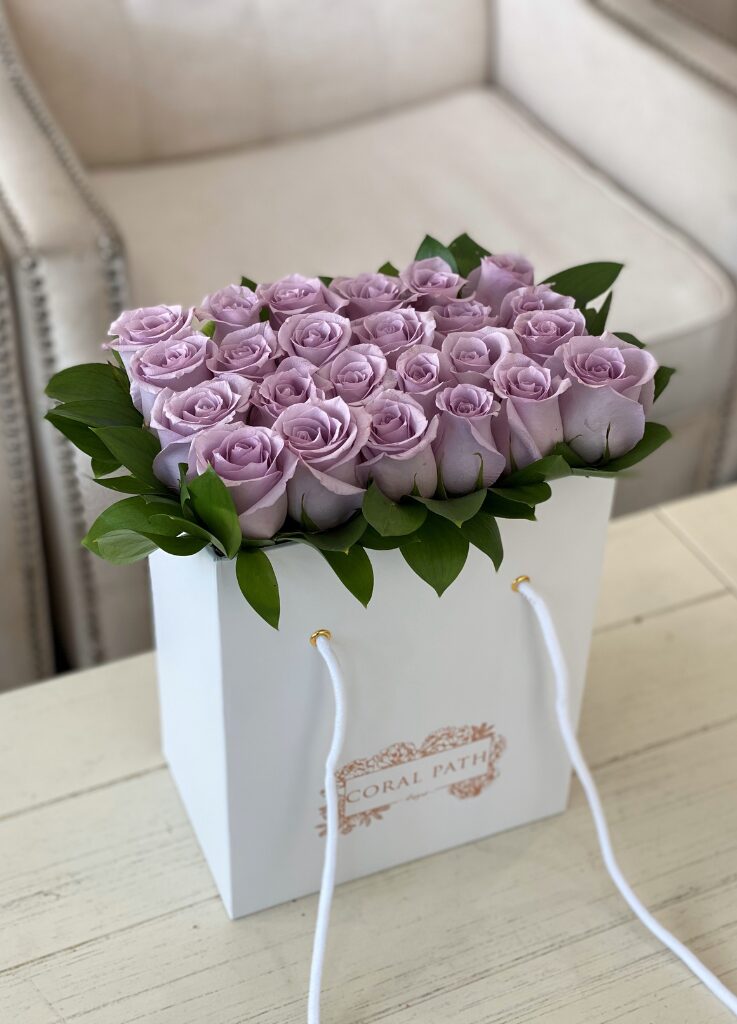 Lavender roses neatly arranged in a bag box from Coral Path