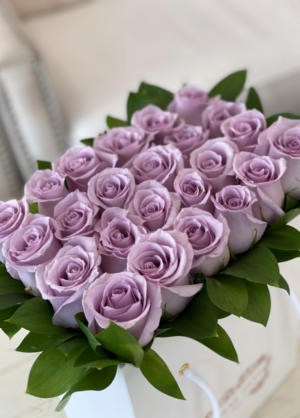 Lavender roses neatly arranged in a bag box from Coral Path