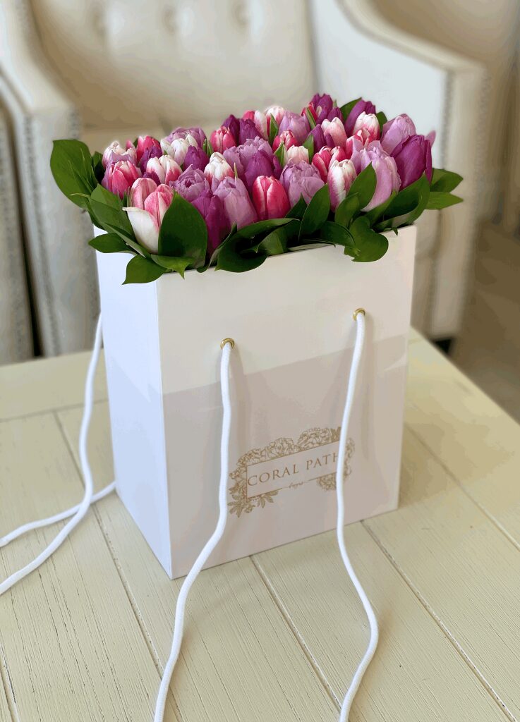 Tulips neatly arranged in a box.