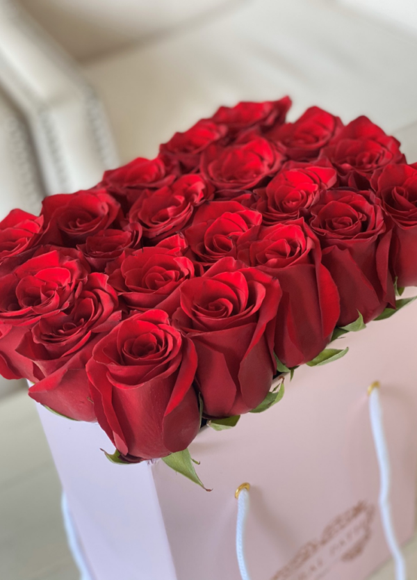 Red roses neatly arranged in a pinbag box from Coral Path