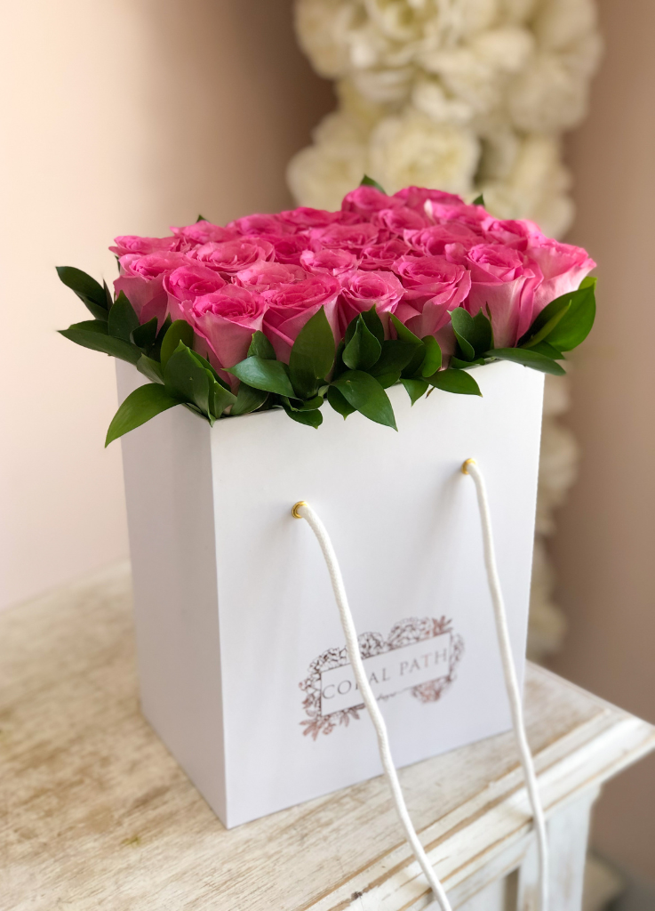 Sweet Unique roses neatly arranged in a bag box from Coral Path