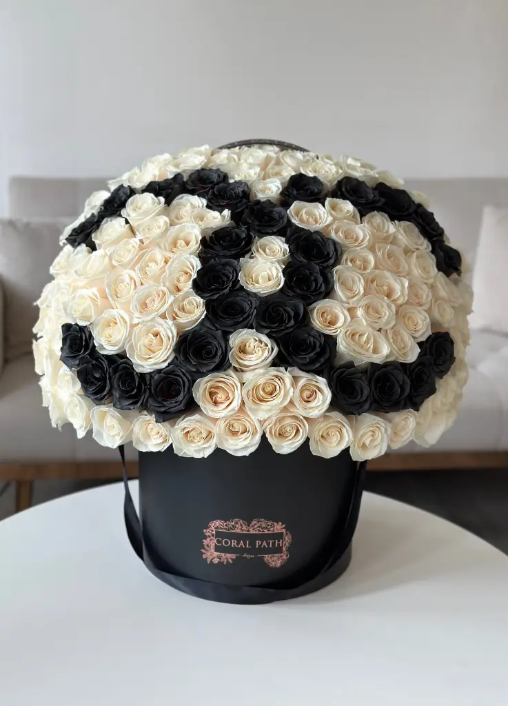 Chanel logo roses in a hat box.