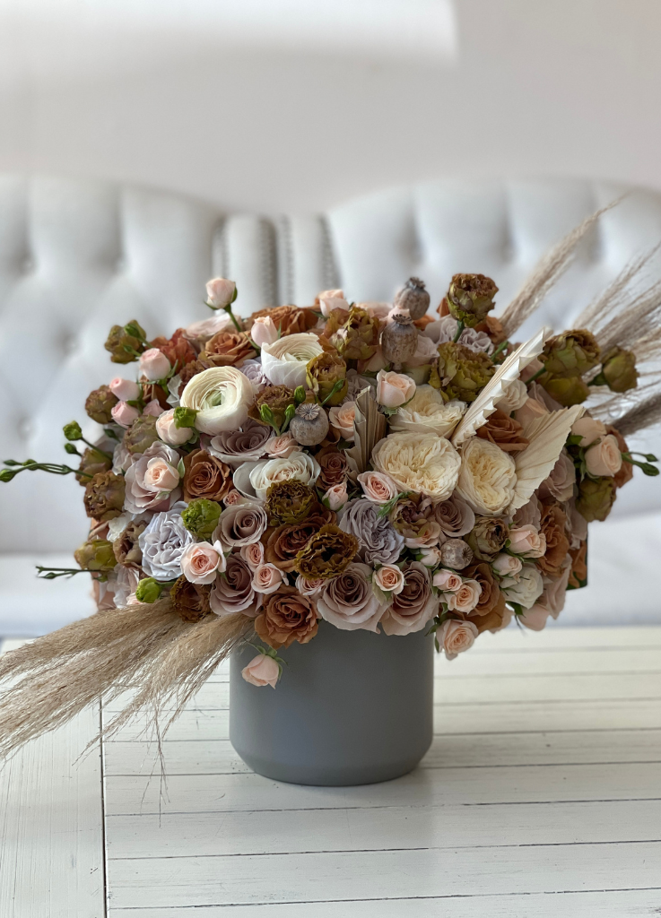 Image of 'Jolene' flower arrangement, featuring vintage-inspired Toffee roses, neutral palette, dried pampas grass, and fan leaves for an elegant display.