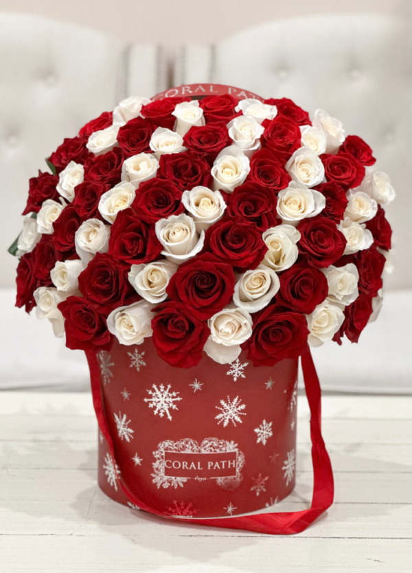Image description: Peppermint-themed Christmas arrangement, featuring all-rose design, a festive touch to spruce up the holiday spirit.