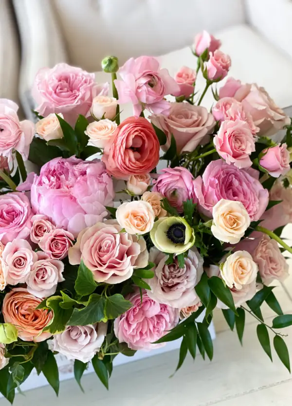 Dreamy pastel pink flowers in a long centerpiece box.