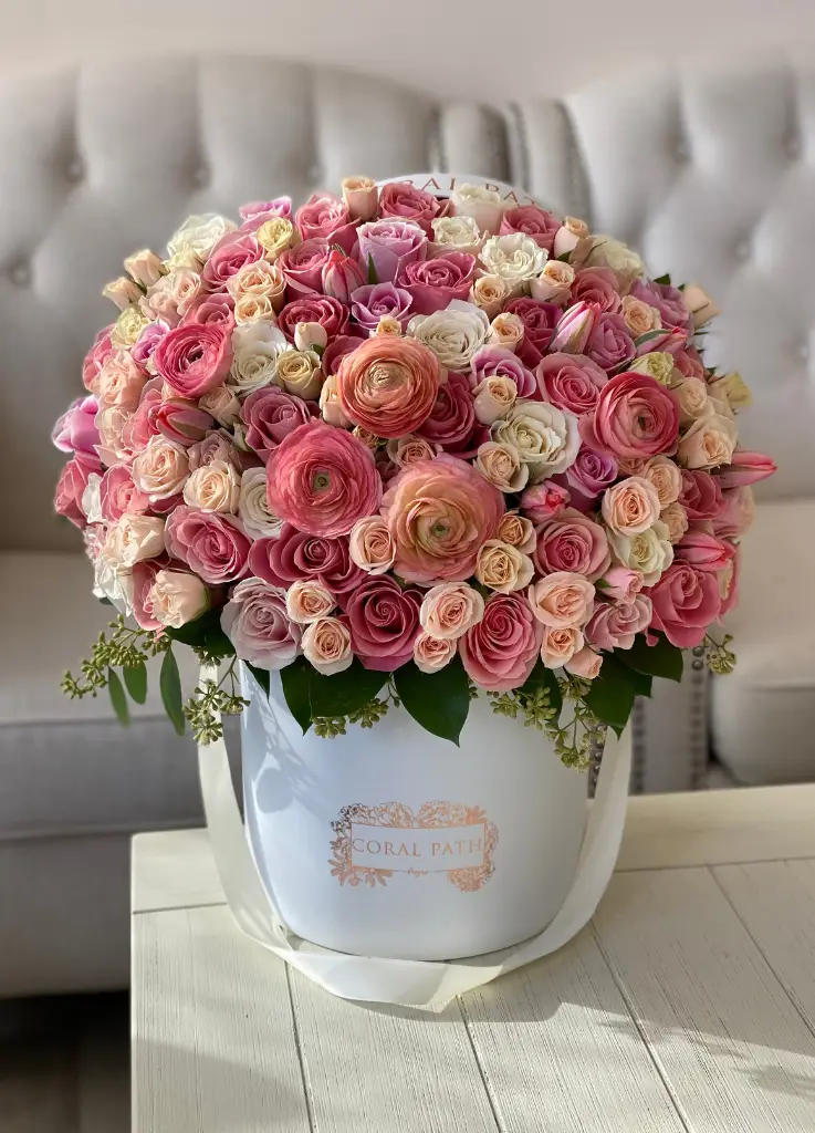 coral colored flowers in a hat box