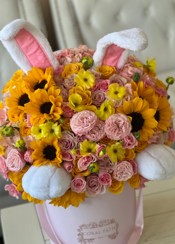 bunny ears and paws in a flower arrangement