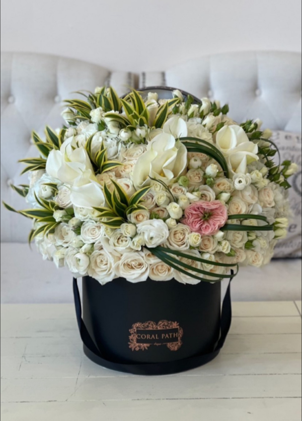 calla lilies and roses mixed in a hat box
