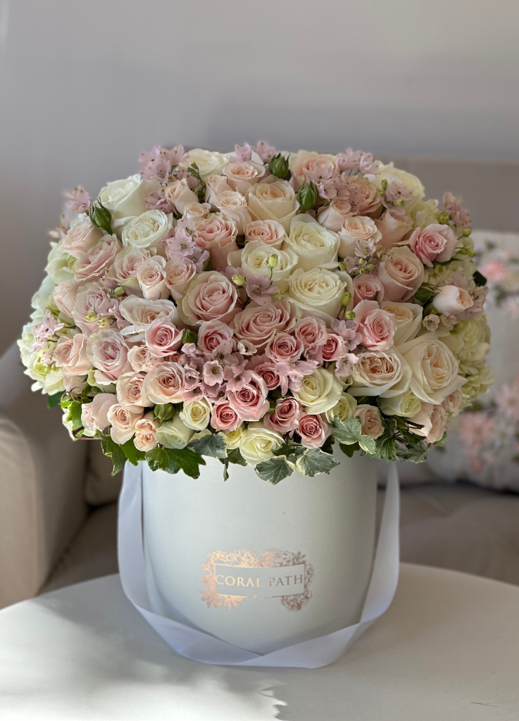 "Pour Les Filles," crafted for soft color lovers, showcases pastel roses and blossoms, embodying tender elegance for cherished recipients.