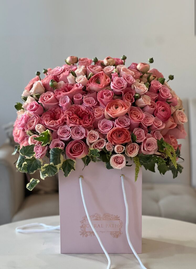coral flowers in a signature box, flower delivery